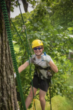 Portrait of smiling teenage boy (16-17) tree climbing
Meadows of Dan, Virginia, USA