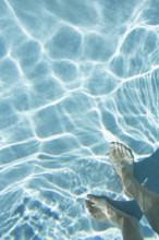 Overhead view of mans feet in swimming pool
St. John, US Virgin Islands, USA