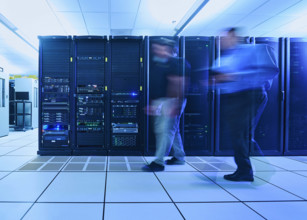 Two men walking in data center