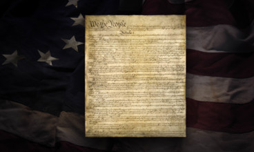 American Constitution superimposed over early thirteen star flag
