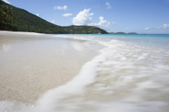 USA, United States Virgin Islands, St. John, Close-up of surf washing sandy beach