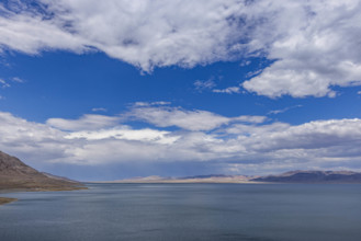 USA, Nevada, Henderson, White puffy clouds over calm Walker Lake