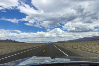 USA, Nevada, Henderson, Empty road and clouds seen from car
