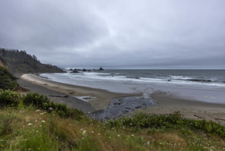 USA, Oregon, Cannon Beach, Gray clouds over empty beach