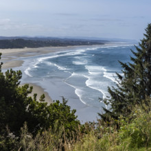 USA, Oregon, Newport, Sea waves washing empty beach