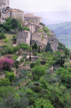 France, Gorde, Stone houses and trees on hillside