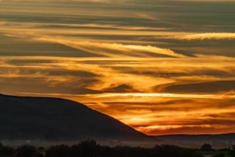 USA, Idaho, Bellevue, Silhouette of hill against sky at sunset