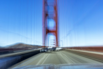USA, California, San Francisco, Motion blur image driving across Golden Gate Bridge