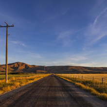 USA, Idaho, Bellevue, Empty dirt road in rural landscape