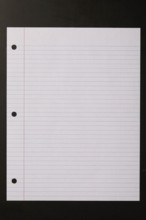 Blank lined paper on black background