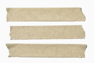 Three straps of masking tape on white background