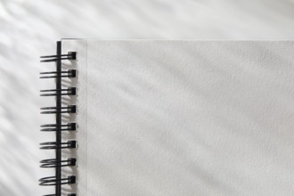 Close-up of open  spiral notebook
