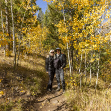 Portrait of smiling couple in autumn landscape