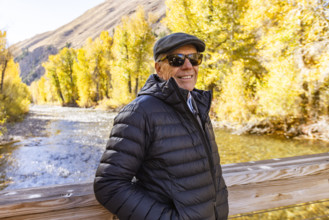 USA, Idaho, Bellevue, Portrait of smiling senior man by river