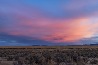 USA, Idaho, Boise, Dramatic sunrise sky above fields