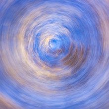 Low angle view of trees against sky motion blur