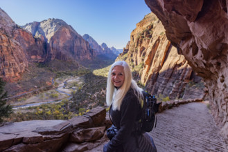 USA, Utah, Zion National Park, Portrait of senior woman on trail to Angels Landing