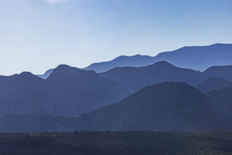 USA, Utah, LaVerkin, Silhouettes of mountain ranges against clear blue sky