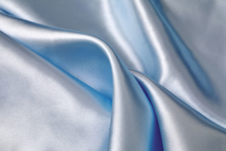 Close-up of folded light blue silk