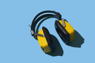 Vintage headphones on blue background