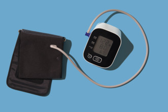 Blood pressure gauge on blue background