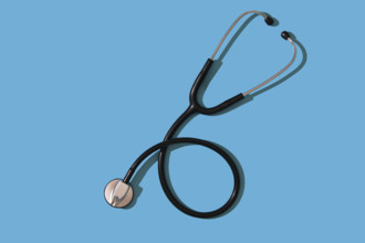 Stethoscope on blue background