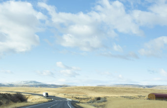 USA, Idaho, Single truck on highway in landscape