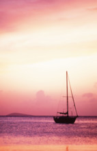 USA, United States Virgin Islands, St. Thomas, Silhouette of sailboat on Pillsbury Sound at sunrise