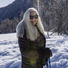 USA, Idaho, Sun Valley, Portrait of smiling woman in landscape on sunny winter day