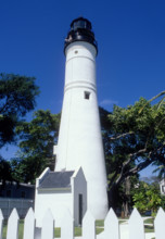 USA, Florida, Key West, White Key West lighthouse against blue sky on sunny day