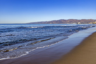 USA, California, Santa Monica, Calm ocean waves on empty Santa Monica Beach