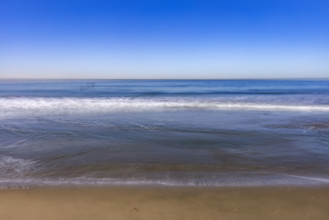 USA, California, Santa Monica, Calm ocean waves on empty Santa Monica Beach