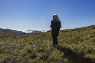 USA, California, Tiburon, Senior female hiker on Ring Mountain