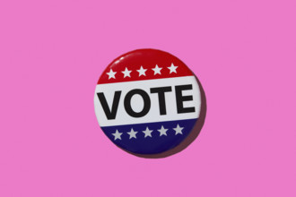 Vote pin on pink background. New York City, New York State, USA.