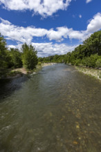White puffy clouds above Big Wood River . Bellevue, Idaho, USA.