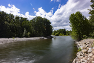 Clouds above motion blurred Big Wood River. Bellevue, Idaho, USA.