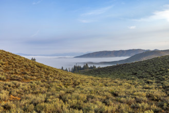 Fog over lowlands from Cat Creek Summit. Mountain Home, Idaho, USA.