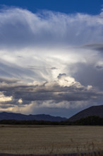 Storm clouds over field. Bellevue, Idaho, USA.