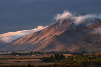 Clouds covering hills in late afternoon light. Bellevue, Idaho, USA.