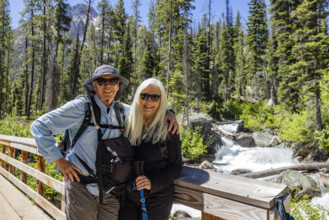 Portrait of senior hikes in Sawtooth Mountains by Redfish Creek. Stanley, Idaho, USA.