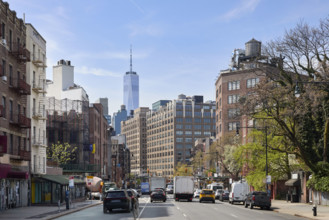 Traffic on street with One World Trade Center in background. New York City, New York State, USA.