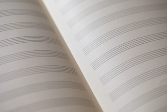 Close-up of blank sheet music paper . New York City, New York State, USA.