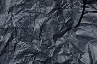 Close-up of wrinkled black tissue paper. New York City, New York State, USA.
