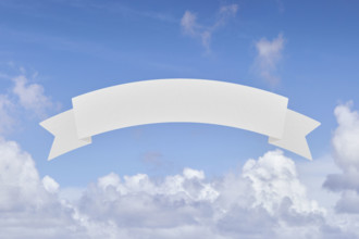 Blank banner in front of blue sky and white clouds. New York City, New York State, USA.