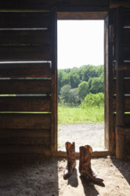 Cowboy boots at barn door. Nashville, Tennessee, USA.