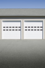 Closed garage doors on sunny day. Mendham, New Jersey, USA.