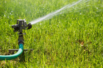 Close-up of lawn Sprinkler watering lawn. Mendham, New Jersey, USA.