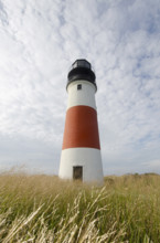 Sankaty Head Lighthouse against cloudy sky, Nantucket, Massachusetts, USA.
