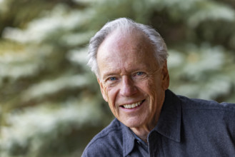 Portrait of smiling senior man outdoors, Bellevue, Idaho, USA.