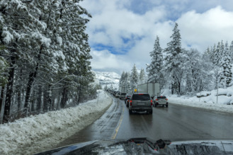 Traffic on highway in Winter seen from car, Truckee, California, USA.